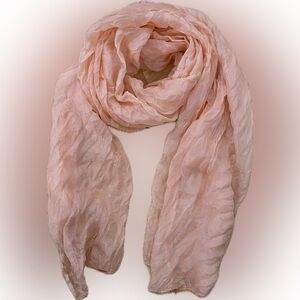 Very light weight peach colored scarf.